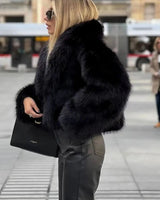 Dames pluizige imitatiebontjas 7